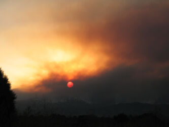 Digital photograph of sunset during mountain fires west of Boulder CO in 2010; © 2010 L. Eilee S. George