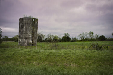 A silo I pass between Kansas City and Joplin each visit home © 2022 L. Eilee S. George