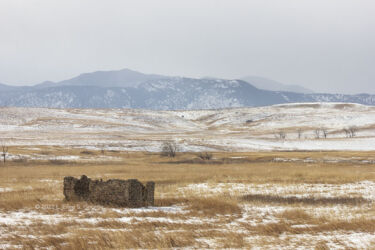 Ruin in the snow looking at the Front Range of the Denver area Rocky Mountains © 2022 L. Eilee S. George