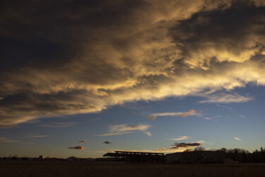 Sunset over a warehouse in construction Jefferson County CO © 2021 L. Eilee S. George