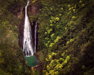 Manawaiopuna Falls used in movie Jurrassic Park on Kauai shot from helicopter in 35mm film © 1998 Linda Eilee S. George and faded print scanned and digitally color-corrected and enhanced by her 2021